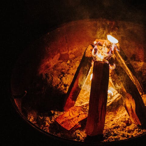 Gather around the campfire area in the woods – perfect for toasting marshmallows