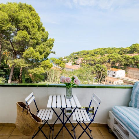 Retreat to the balcony with an elevated view over the Mediterranean coastline