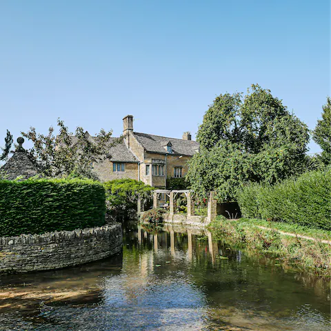 Explore the chocolate-box setting at Bourton-on-the-Water, less than fifteen minutes away