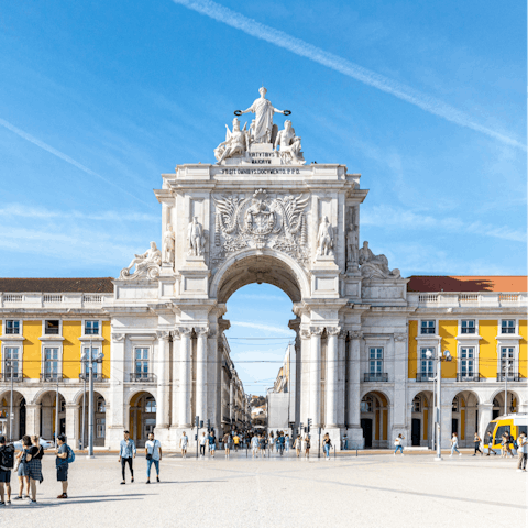 Visit bustling Praça do Comércio, a ten-minute walk away