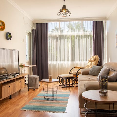 Relax on the sofas with a glass of ayran after a day by the water