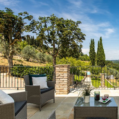 Watch the sun go down as you sip cocktails overlooking the Tuscan countryside