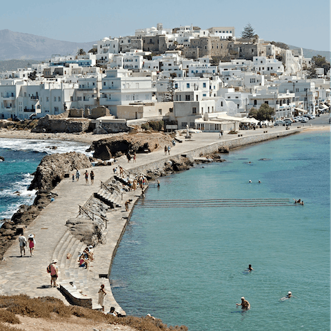 Explore Naxos Town, a six-minute drive away