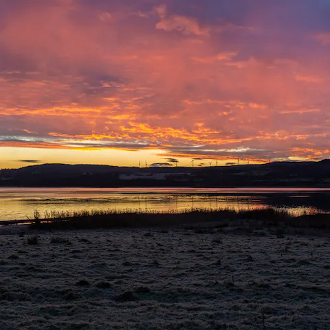 Admire the spectacular sunsets reflected in the loch