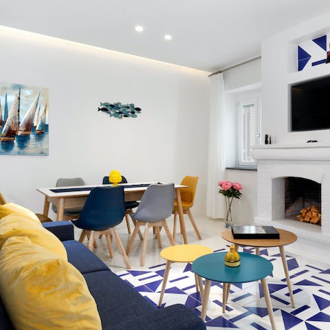 Kick back in the blue and yellow-hued living area after a long day on your feet