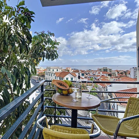 Savour refreshing drinks while admiring the views from the balcony