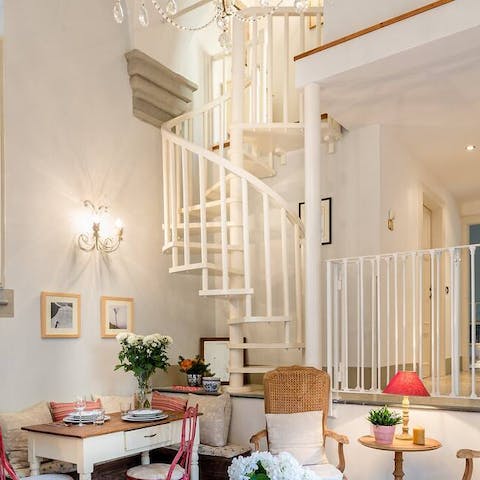 Descend the elegant, white, spiral staircase as you head out to dinner