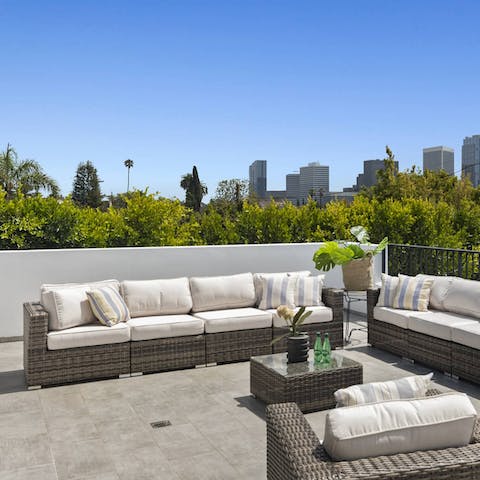 Gaze upon the LA skyline on your own stylishly outfitted rooftop terrace