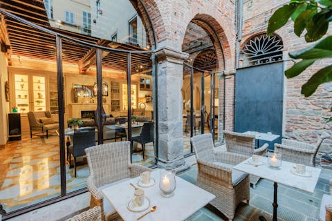 Enjoy a glass of Prosecco in the courtyard