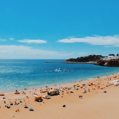 Drive five minutes to the coast and explore the Algarve's sandy beaches