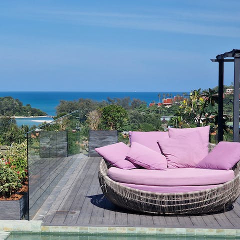 Take a book out to the daybed and soak in the stunning views of the ocean