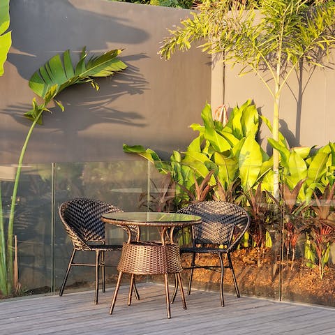 Share your morning pastry with the birds in the leafy sitting area