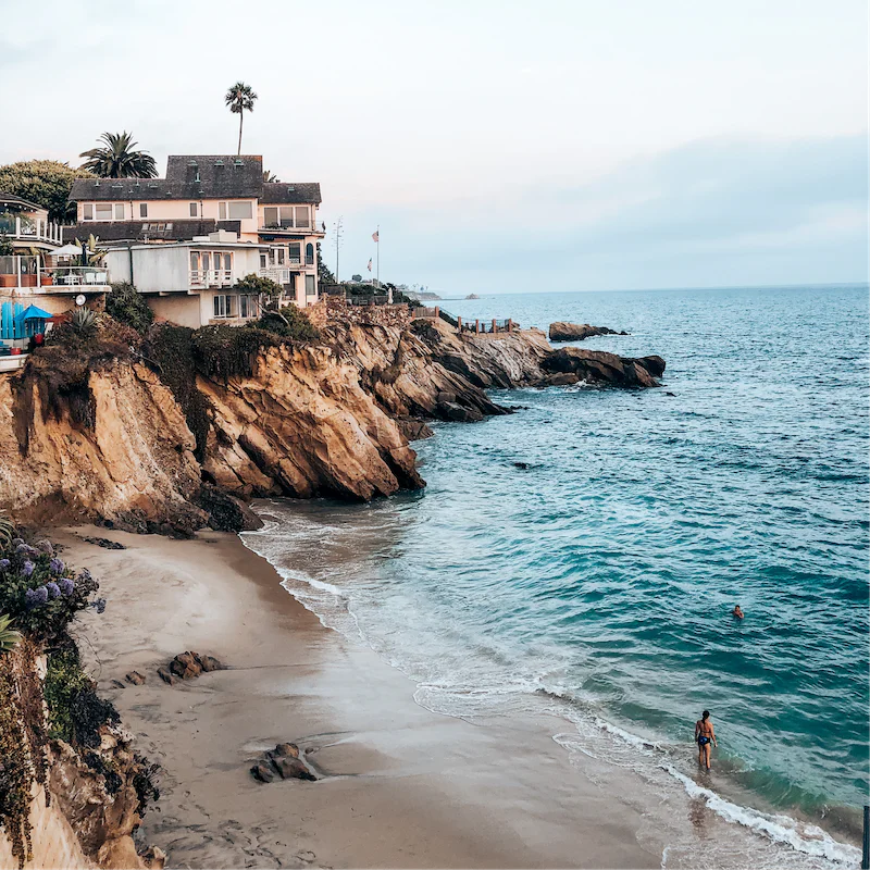 Explore Laguna Beach with its sandy stretches, hidden coves and seasonal festivals