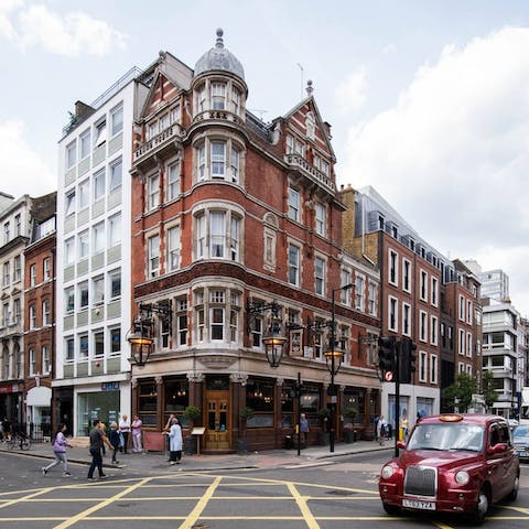 Explore Fitzrovia's array of cosy pubs, high-end shops and gourmet eateries