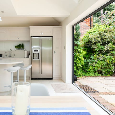 Sweep aside the huge bi-folding doors to open the kitchen and dining room right up to the terrace