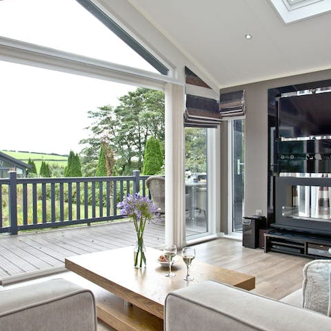 Slide open the bifold doors and let the outside in, as you stretch out on the sofa