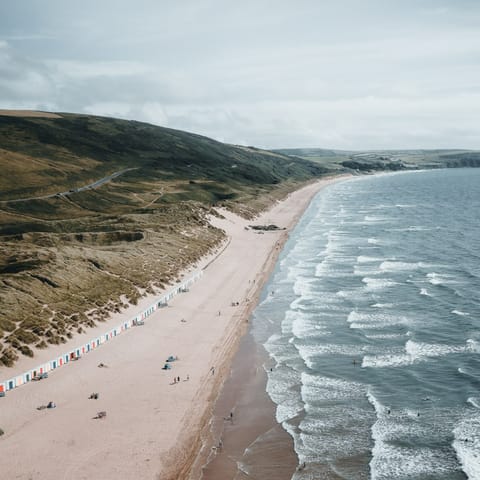Stroll along Woolacombe's dune-backed beach to Putsborough, or grab a board and hit the surf, just a twenty-minute drive away