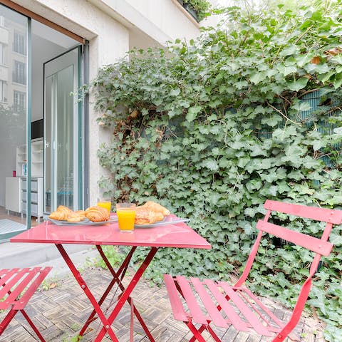 Tuck into an alfresco breakfast on the leafy terrace