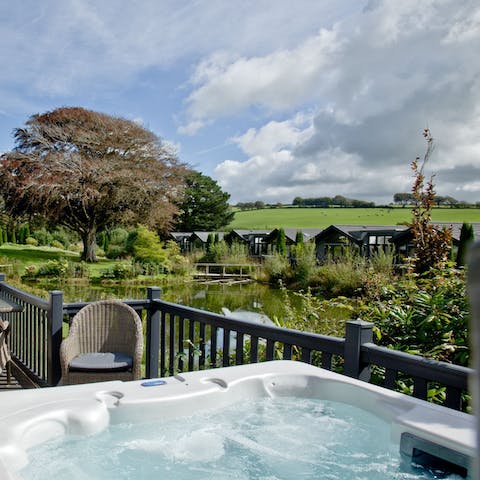 Pour a glass of your favourite tipple and unwind in your private hot tub