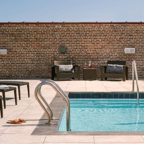 Cool off into the rooftop pool and admire the views
