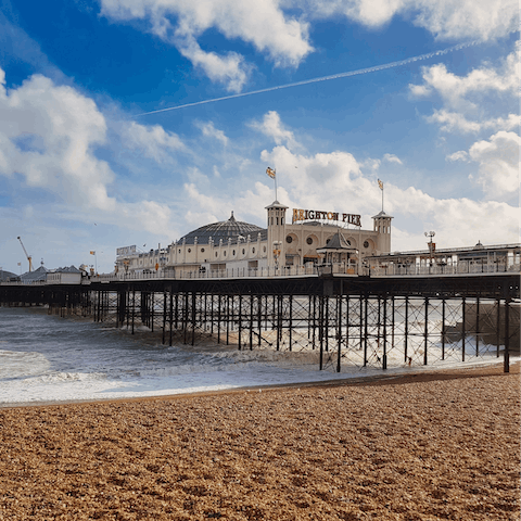 Stroll along iconic Brighton Pier, just a short walk from the apartment