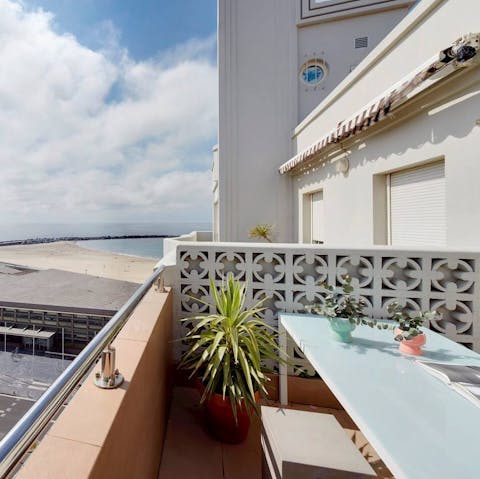 Sip your morning coffee on the balcony while you gaze at the nearby beach