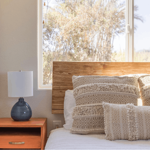 Snuggle up with a hot tea and a good book in the cosy bed