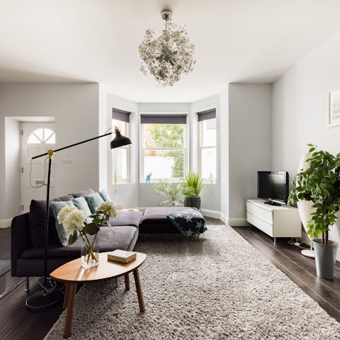 Relax in the bright living space after a day of exploring the city
