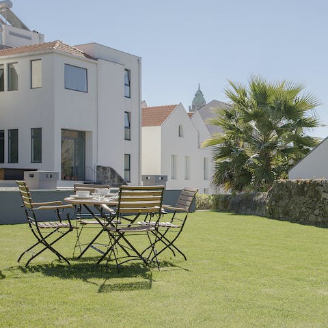 Gather in the communal garden after lunch for a glass of local wine