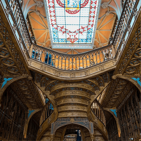 Stroll nine minutes to the striking interiors of Livraria Lello