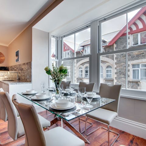 Dine together in the home's impressive bay window