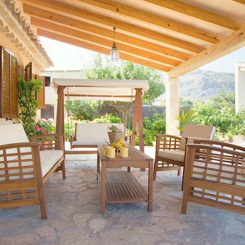 Gather under the pergola to share a glass or two of Moli 