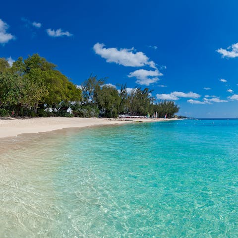 Spend idyllic days on Colony Club Beach, just over a five-minute walk away