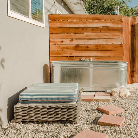 Soak in the sun in the outdoor cowboy bathtub – with running hot water