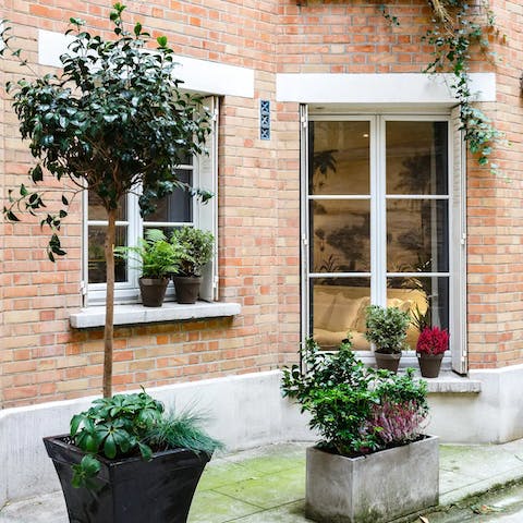 Stay in a charming red brick apartment on a quiet street