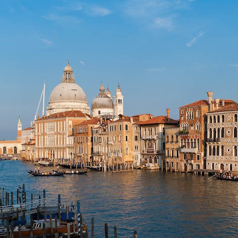 Marvel at the Grand Canal from your terrace and from inside this home 
