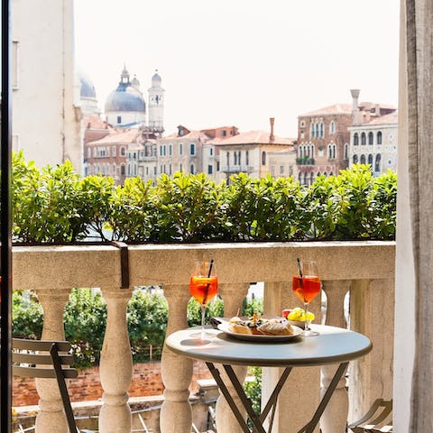 Savour a spritz with a view of Venice on the terrace