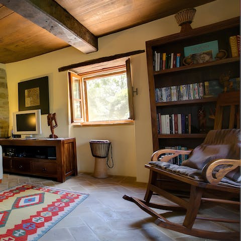 Curl up with a book from the home's library in the reading corner