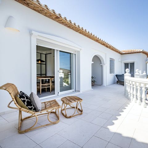 Soak up the sun and gorgeous views out on the terrace