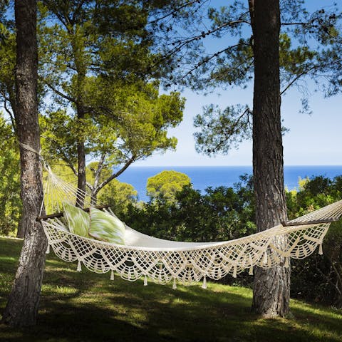 Sway on a hammock under the trees while the Mediterranean sparkles in the distance 