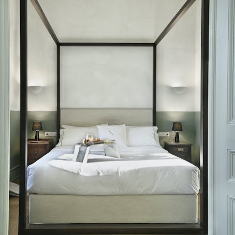Get some rest in the four-poster bed after a busy day in the city