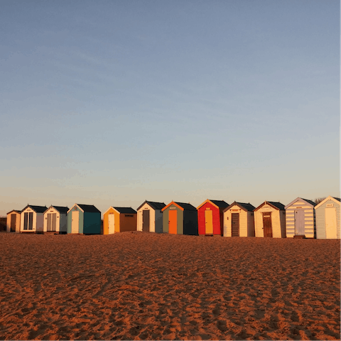 Stroll twelve minutes to the sandy beach to admire the beach huts