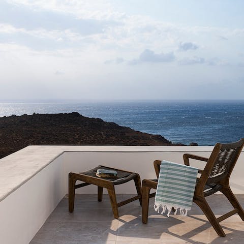 Sip a digestif on the balcony while looking out at the Aegean Sea