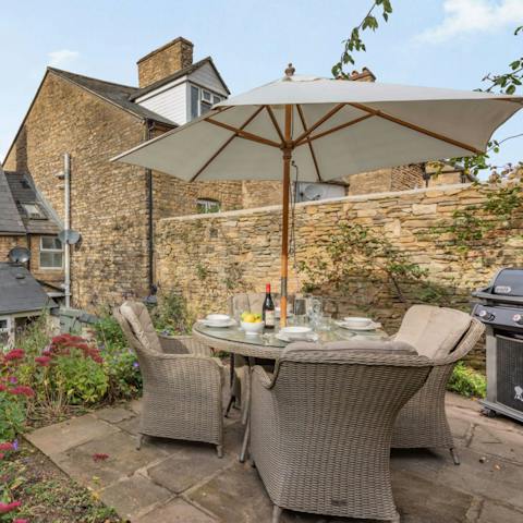 Fire up the grill for an alfresco feast in the whimsical garden