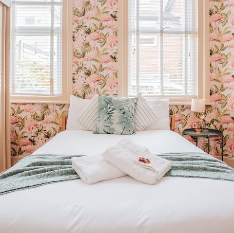 Admire the quirky wallpaper in the bedroom