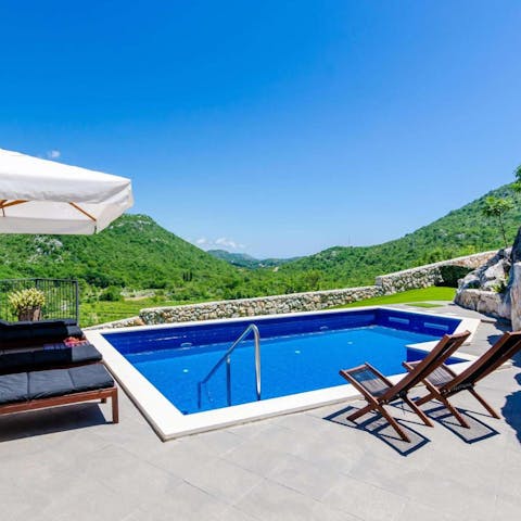 Sunbathe on the loungers and refresh yourself in the pool, overlooking the beautiful hillside