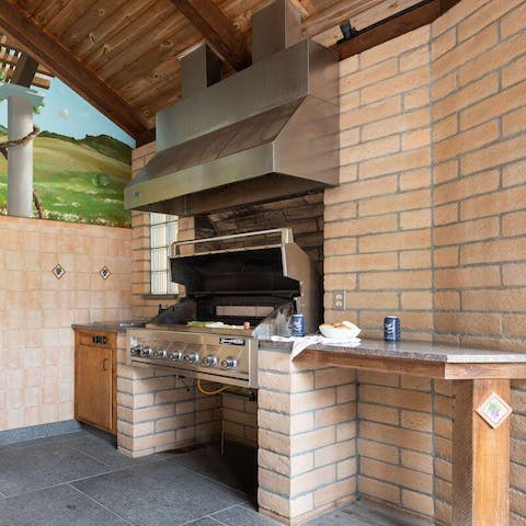 Fire up the grill in the outdoor kitchen for a barbecue