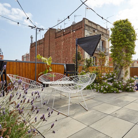 Relax on the communal rooftop terrace with a cool drink after a busy day of exploring