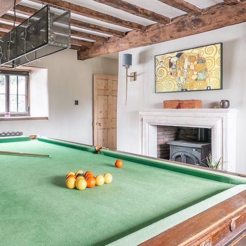 Spend an evening playing pool by the warmth of the stove