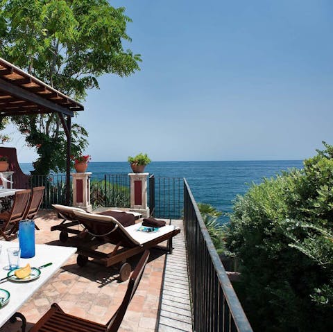 Soak up sweeping views of the Ionian Sea from your terrace
